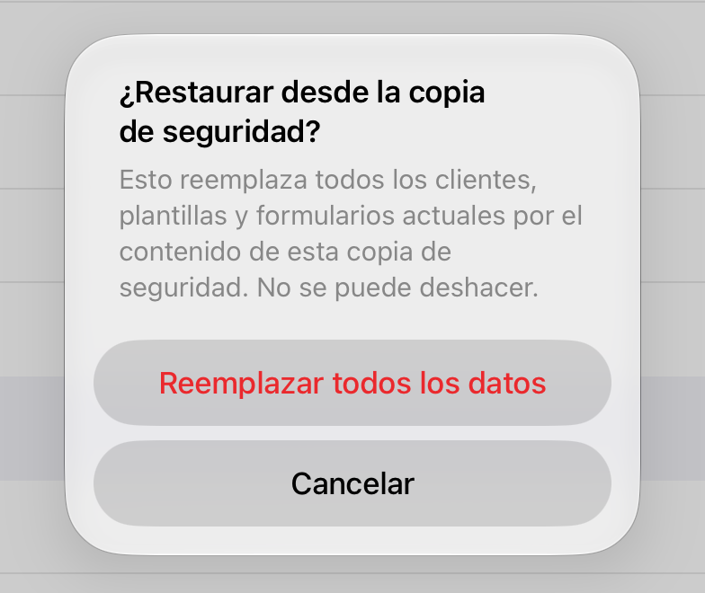 La confirmación de Restaurar desde copia de seguridad, con Reemplazar todos los datos y Cancelar